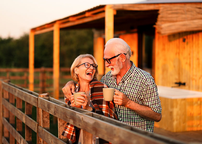 Retired couple enjoying coffee together. 