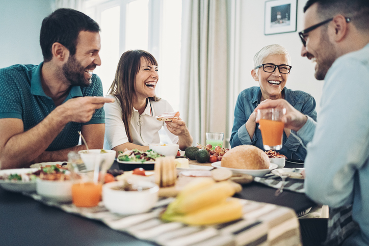 Happy family sitting around a table. Estate equalization. Estate planning.